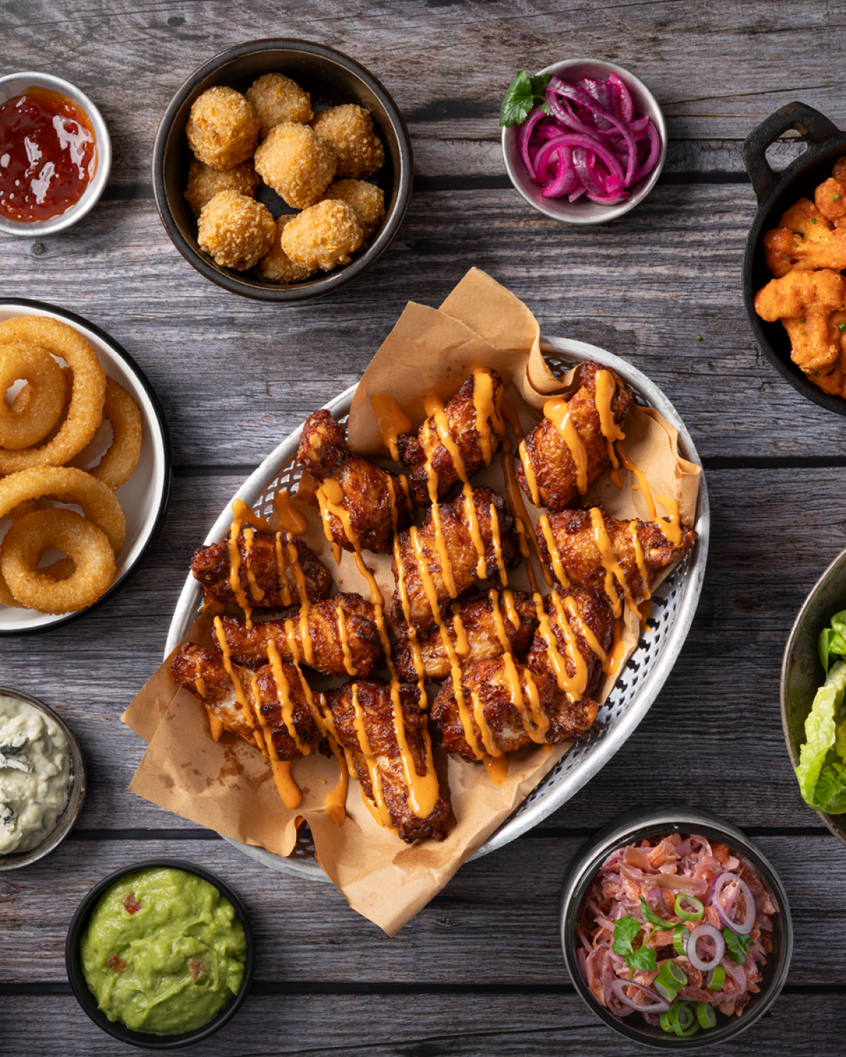 zp_buffalo-wings-drizzled_onion-rings_mac-n-cheese-bites_cauli-wings_tapas_72dpi