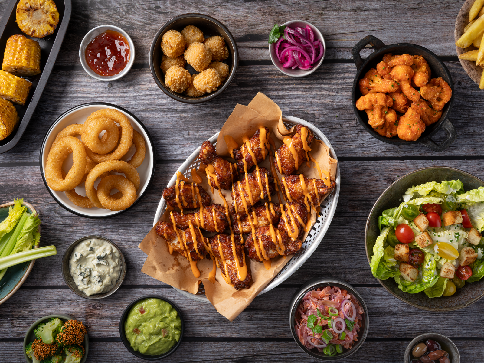 zp_buffalo-wings-drizzled_onion-rings_mac-n-cheese-bites_cauli-wings_tapas_72dpi