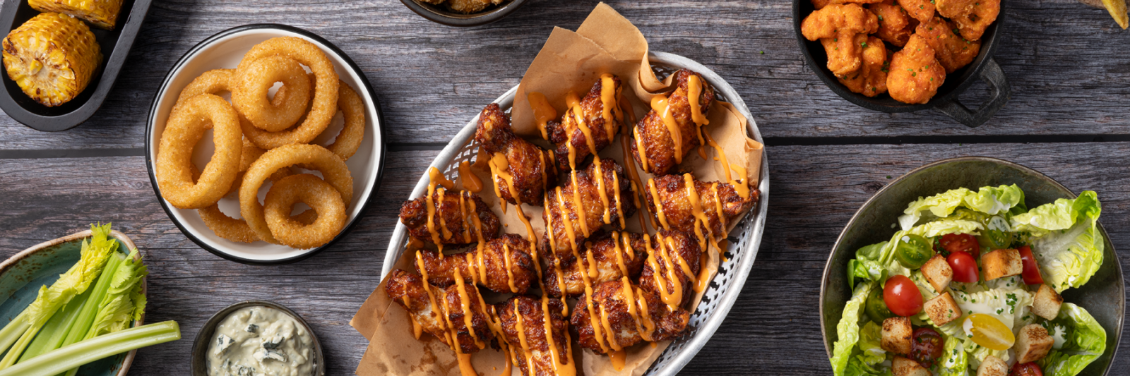 zp_buffalo-wings-drizzled_onion-rings_mac-n-cheese-bites_cauli-wings_tapas_72dpi