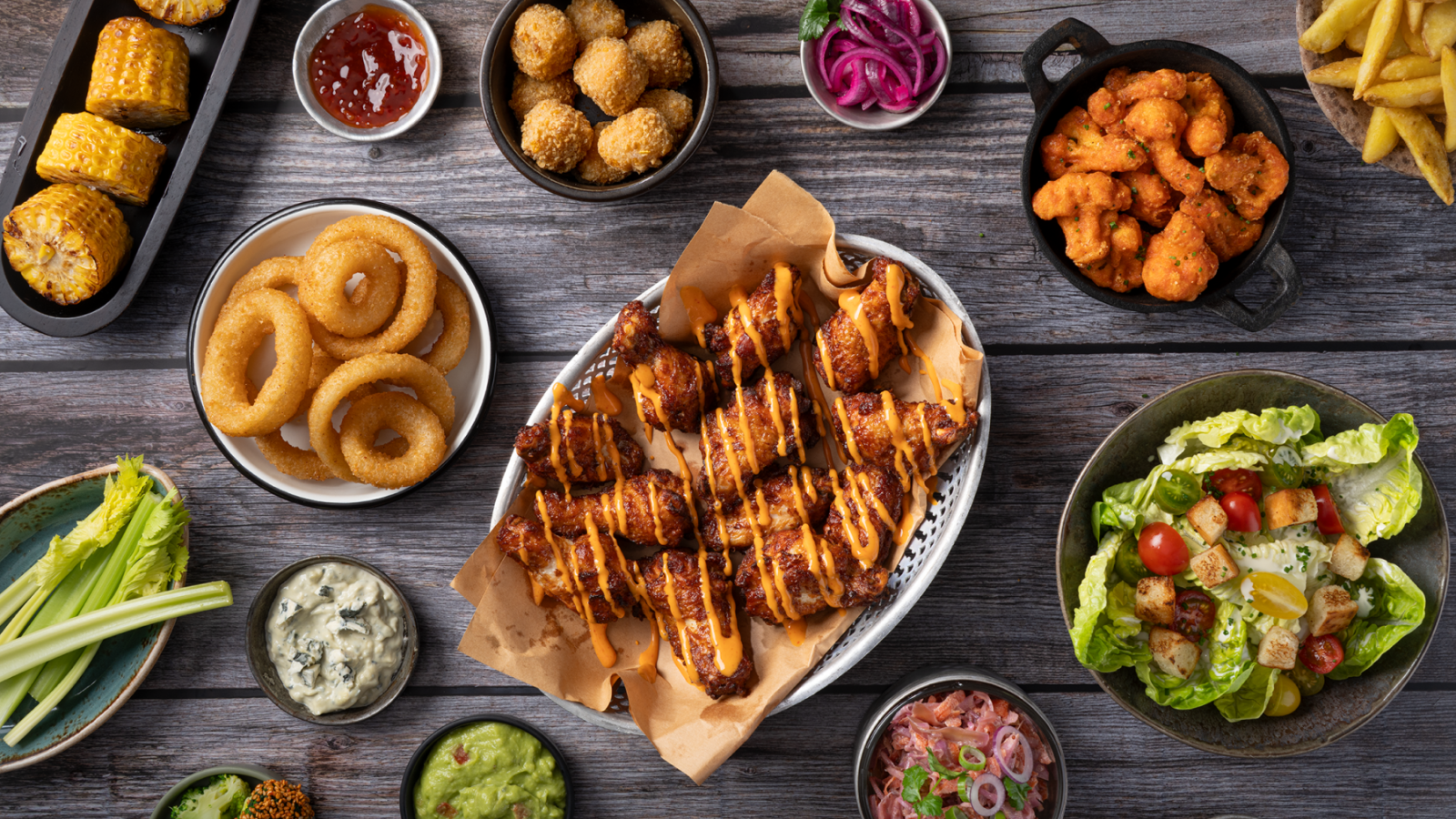 zp_buffalo-wings-drizzled_onion-rings_mac-n-cheese-bites_cauli-wings_tapas_72dpi